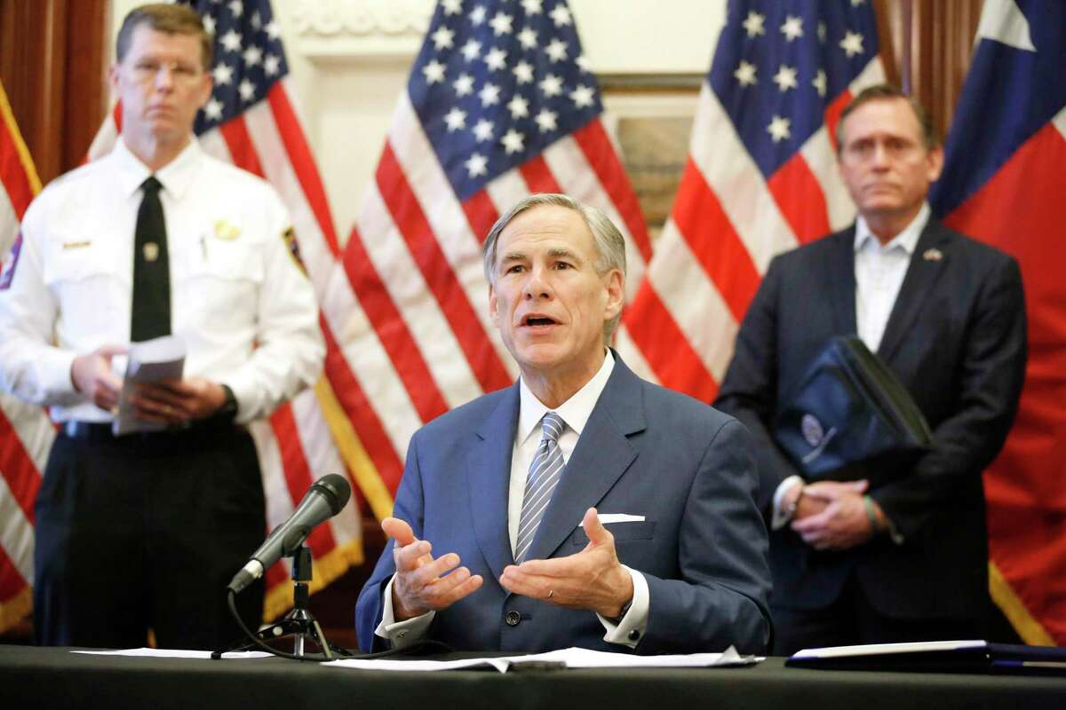 AUSTIN, TX - MARCH 29: Texas Governor Greg Abbott announced the US Army Corps of Engineers and the state are putting up a 250-bed field hospital at the Kay Bailey Hutchison Convention Center in downtown Dallas during a press conference at the Texas State Capitol in Austin, Sunday, March 29, 2020. The space can expand to nearly 1,400 beds. Joining him are Texas Division of Emergency Management Chief Nim Kidd (left) and former State Representative Dr. John Zerwas (right). (Photo by Tom Fox-Pool/Getty Images)