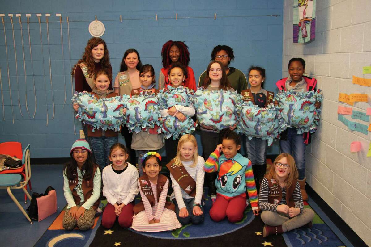 Brownie Troop 60444 and Cadette Troop 60110 came together to make no sew fleece blankets for cats.