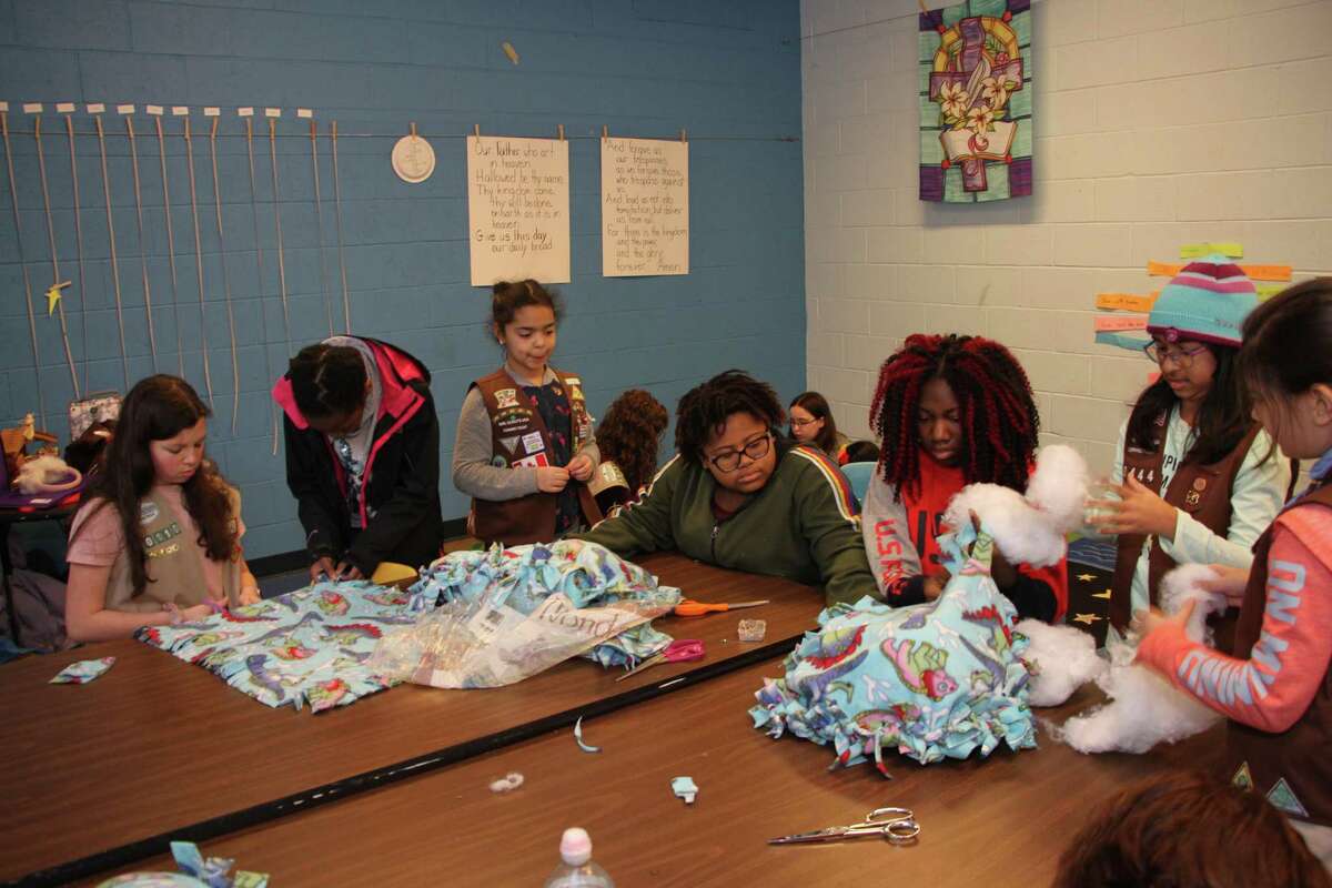 Brownies, Cadettes make blankets for cats
