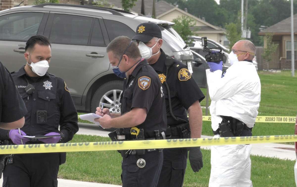 Harris County Sheriff's Office detectives investigate a woman's death inside her home in the 13100 block of Ashley Meadow Lane on Tuesday, March 31, 2020.