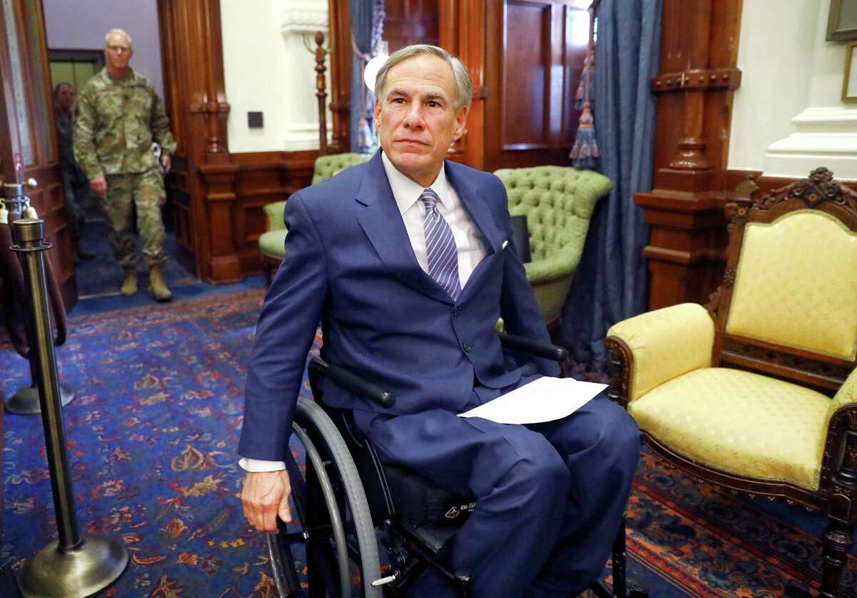 Texas Gov. Greg Abbott arrives for his COVID-19 press conference at the Texas State Capitol in Austin. He and Attorney General Ken Paxton have taken aim at abortion procedures during the coronavirus crisis.