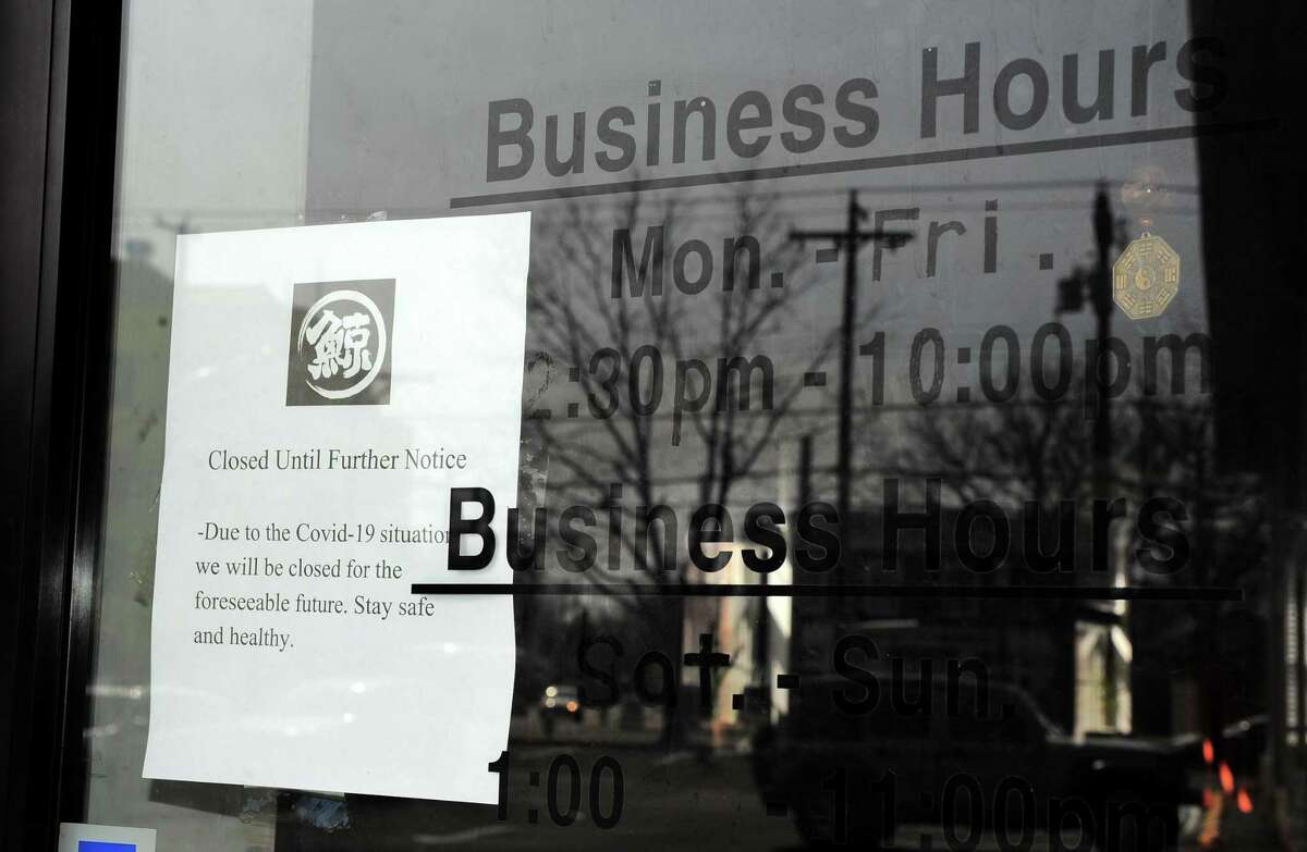 An ice cream shop in Heritage Square recently notifies customers it is closed until further notice in Fairfield, Conn. Some of Fairfield's restaurants are not faring well during the coronavirus closedown.