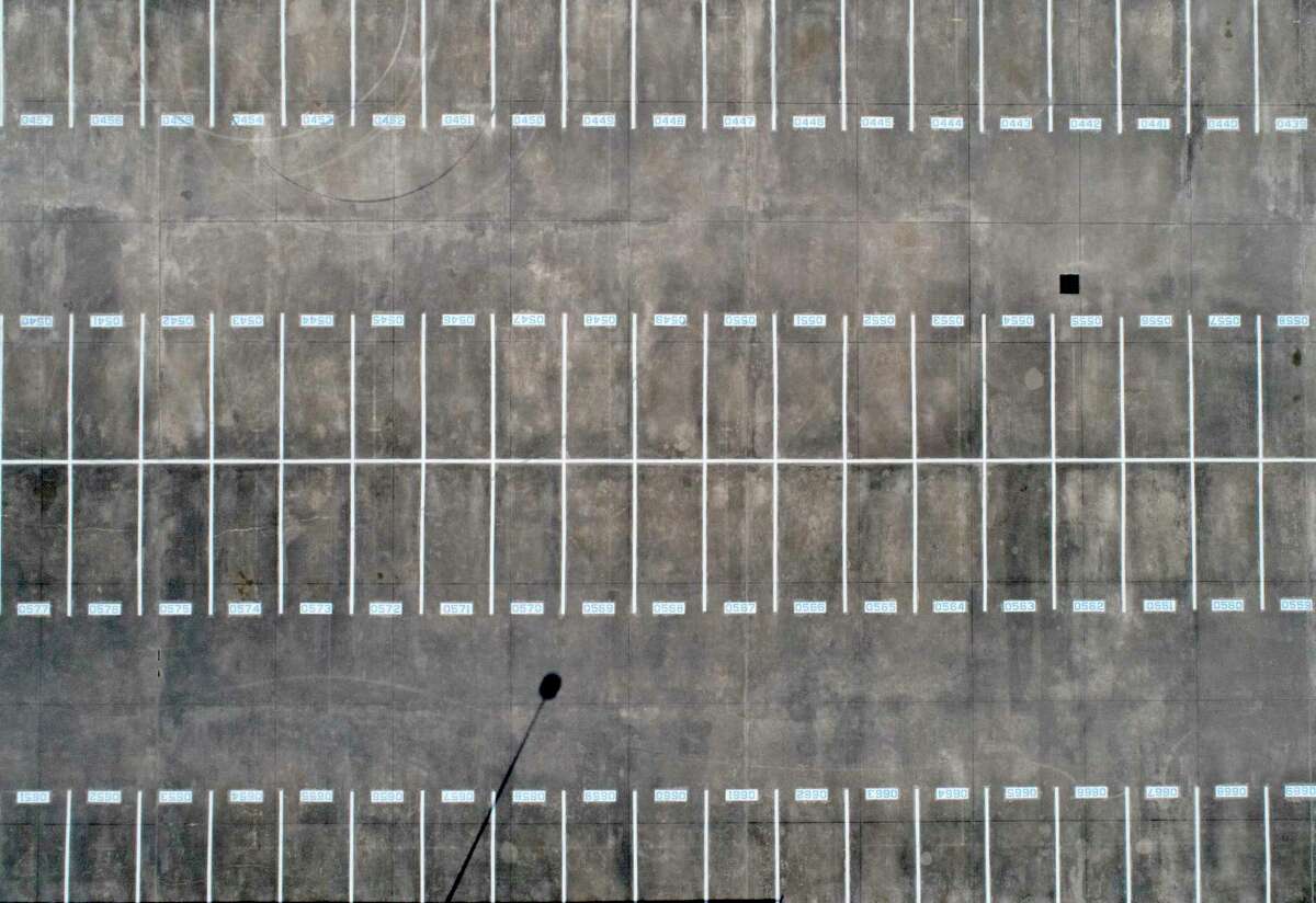 An aerial image of the student parking lot at College Park High School is seen, Friday, March 27, 2020, in The Woodlands.