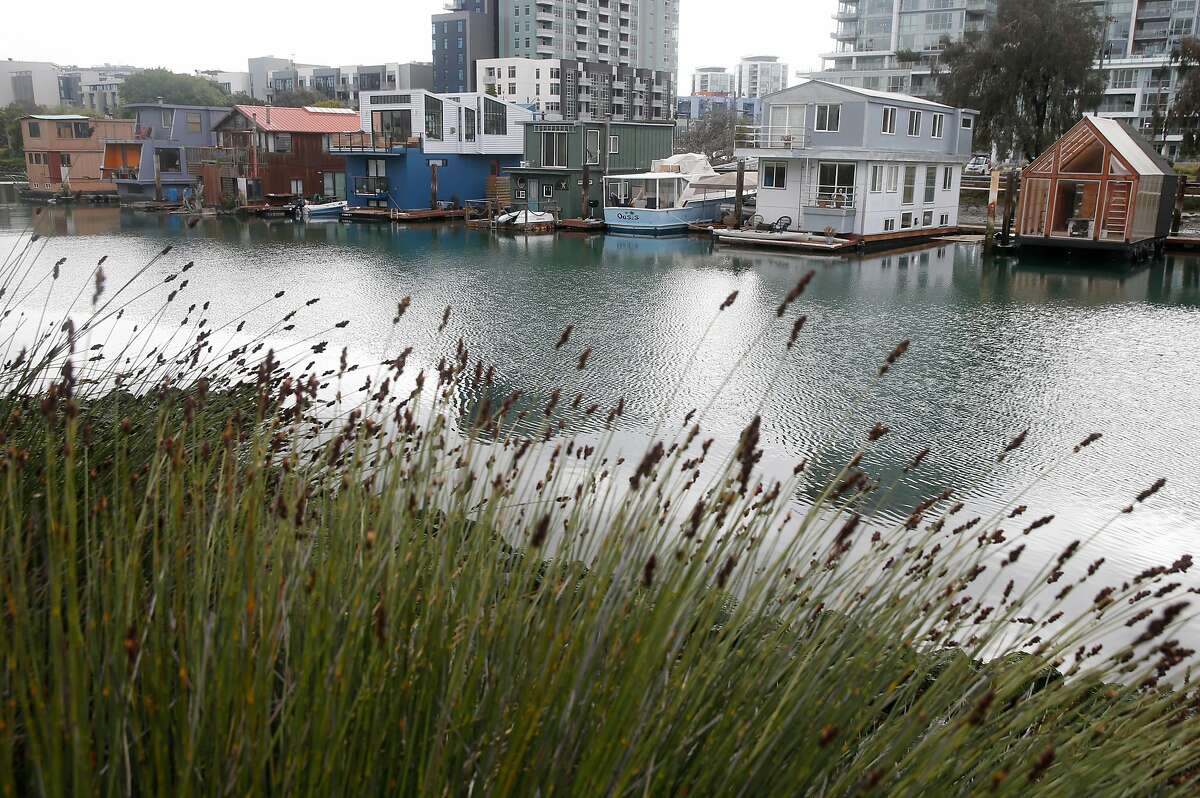 Houseboats line the southern shore of Mission Creek in San Francisco, Calif. on Tuesday, March 31, 2020. A new study suggests that sea level rise could adversely affect Mission Creek's ecosystem and nearby infrastructure projects like the water pumping station and Caltrain tracks running along 7th Street.