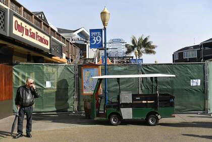 San Francisco resident Jelle Bleyinga reacts after discovering that Pier 39 and Fisherman’s Wharf will be closed on March 17, the day shelter-in-place orders took effect. The Port of San Francisco owns most of the city’s piers and charges businesses rent for the space.