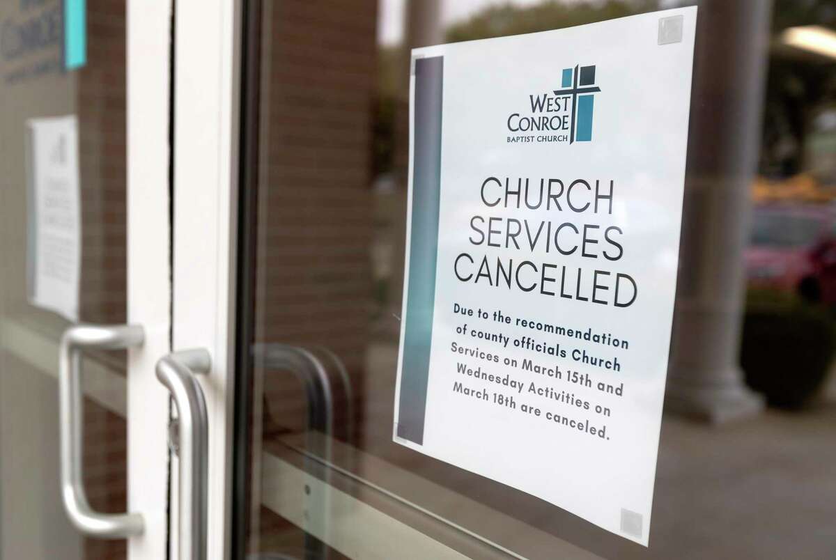 A sign notifies parishioners that church services are canceled at West Conroe Baptist Church, Sunday, March 15, 2020, in Conroe. The church, like many in the region, closed in-house services for parishioners after a disaster declaration was issued for Montgomery County, limiting public gatherings of 250 people or more because of the coronavirus. Many churches opted to stream services online for the safety of parishioners.