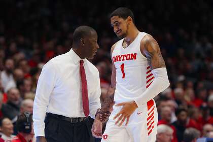 Dayton’s Obi Toppin talks with head coach Anthony Grant during a Dec. 14 game against Drake. Toppin was voted the AP men's college basketball player of the year.