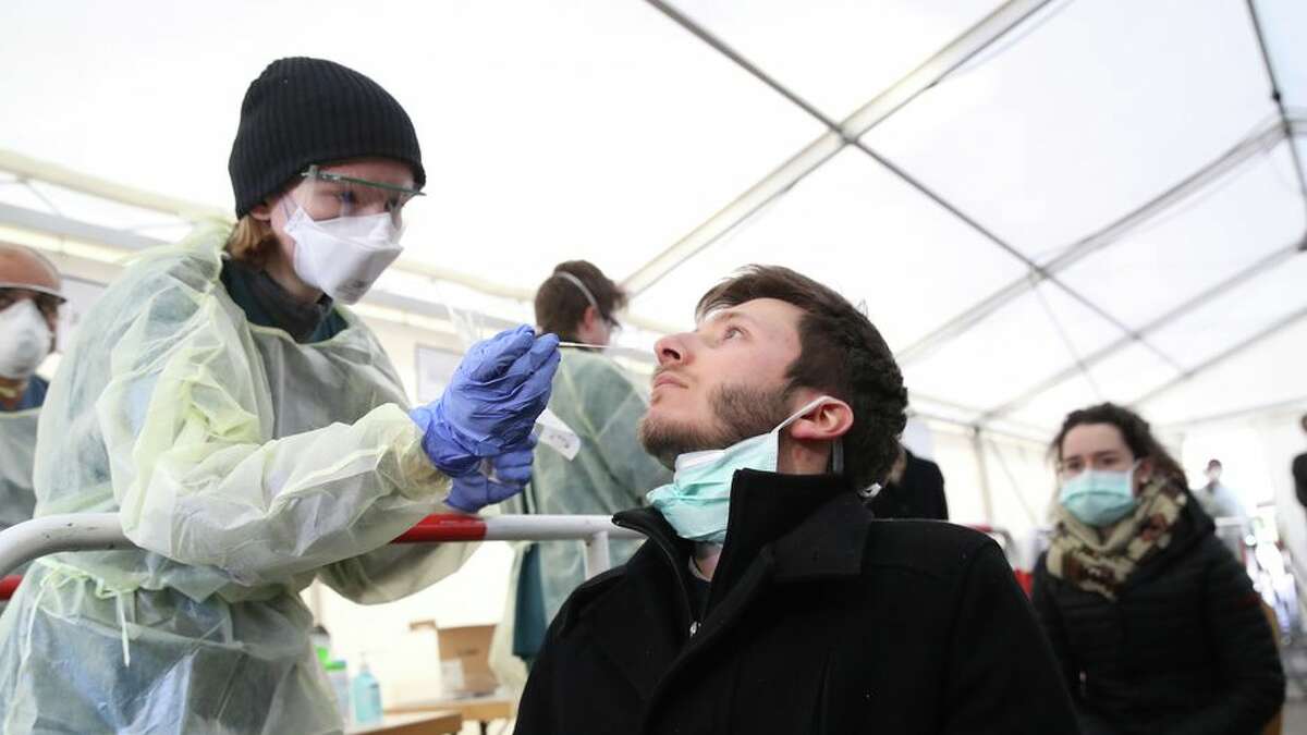 Testing for coronavirus in Germany, medical personnel take samples from the nose.