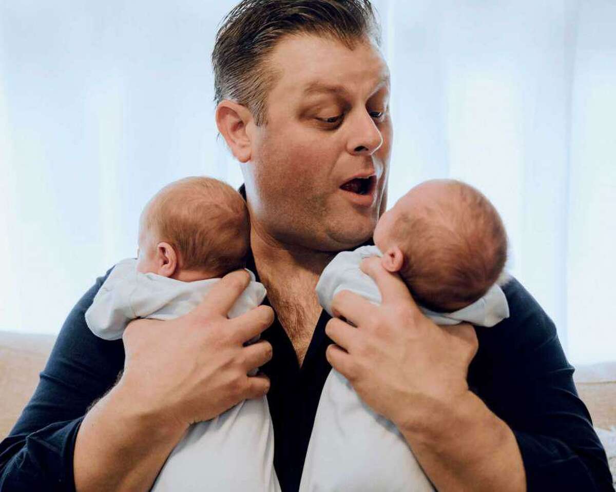 Chris Tillett with his 5-month-old twin sons before he contracted the coronavirus.