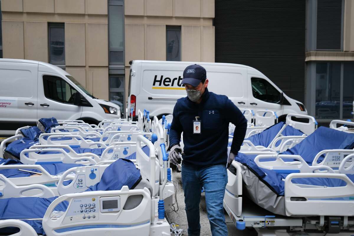 Workers prepare dozens of extra medical beds as they are delivered to Mount Sinai Hospital amid the coronavirus pandemic on March 31, 2020 in New York City. Hospitals in New York City, the nation's current epicenter of the COVID-19 outbreak, are facing shortages of beds, ventilators and protective equipment for medical staff.