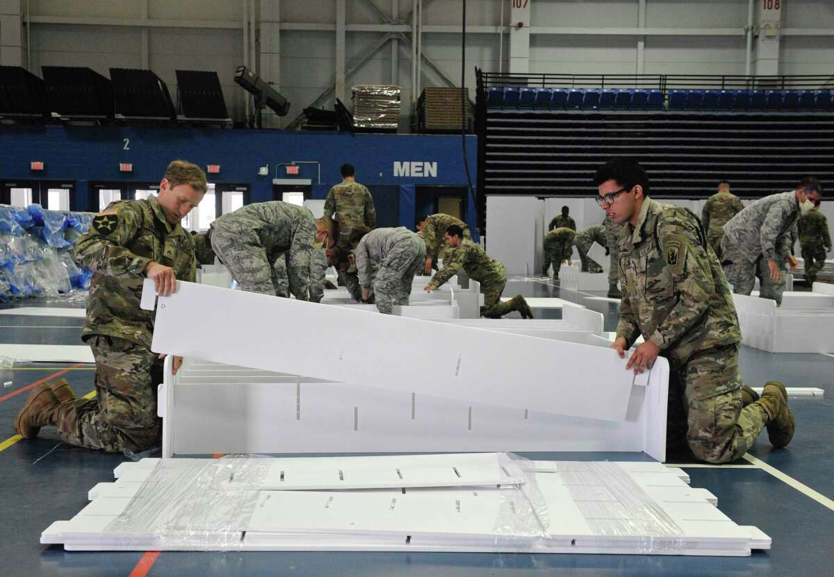 The national guard arrived Wednesday at the O’Neill Center on Western Connecticut State University Westside campus to begin to transform the building into a 219 bed medical space that would be used if area hospitals see a surge in patients. Wednesday, April 1, 2020, in Danbury, Conn.