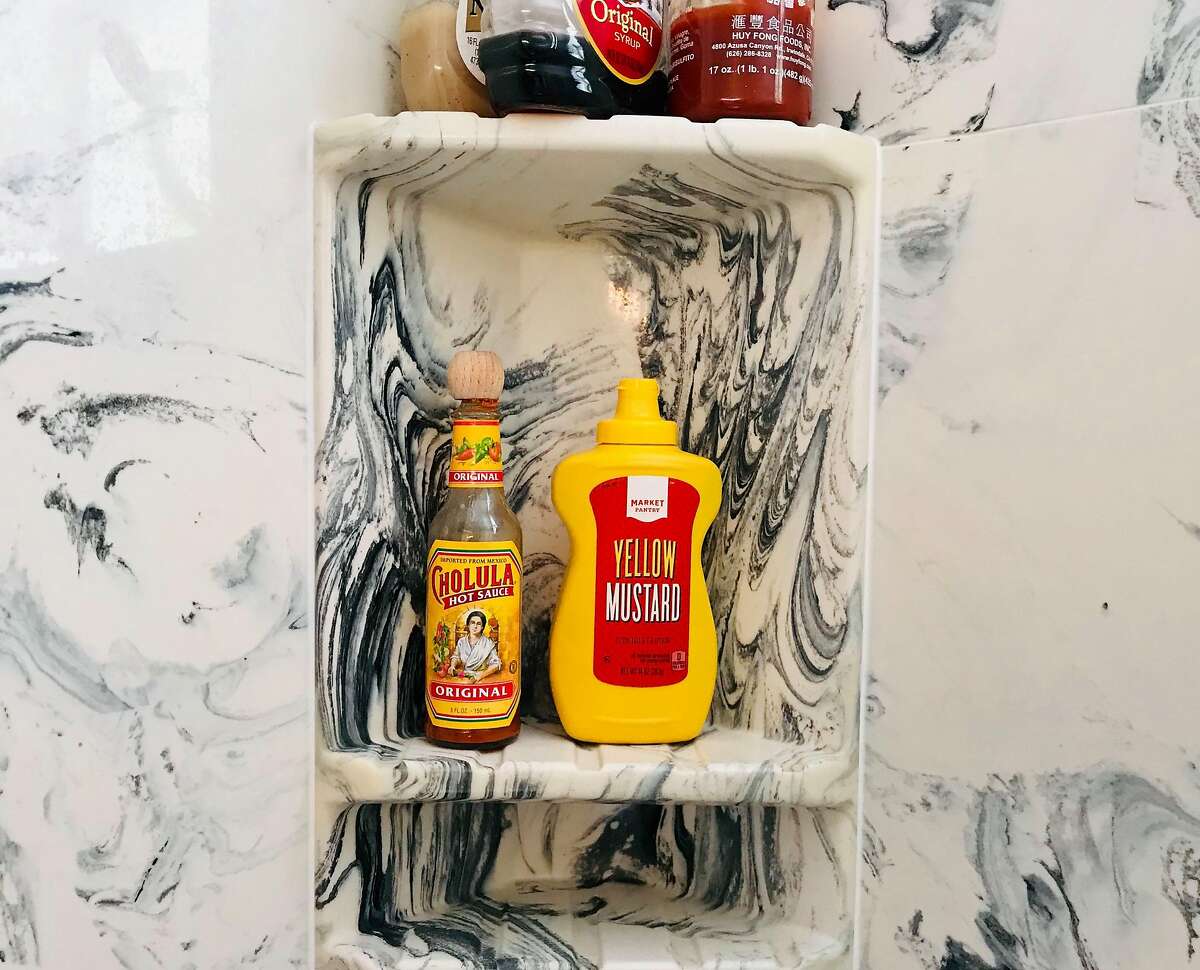 In Alameda, shampoo and conditioner were removed from a shower and replaced with condiments.