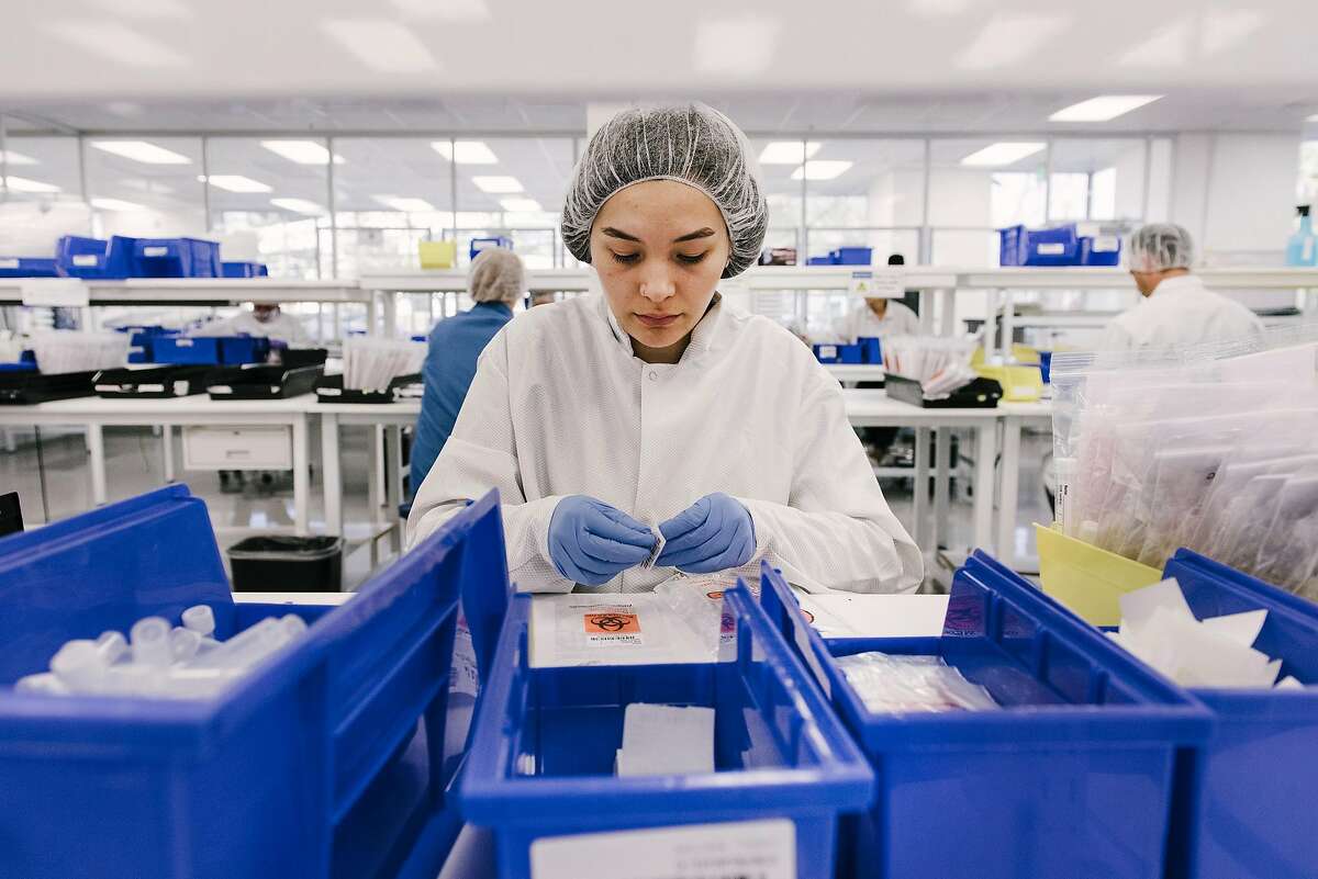Assembly worker Kaitlyn Marquez-Baird assembles Covid-19 testing kits at Evolve Manufacturing Technologies Inc. in Fremont, Calif, on Wednesday, April , 2020.