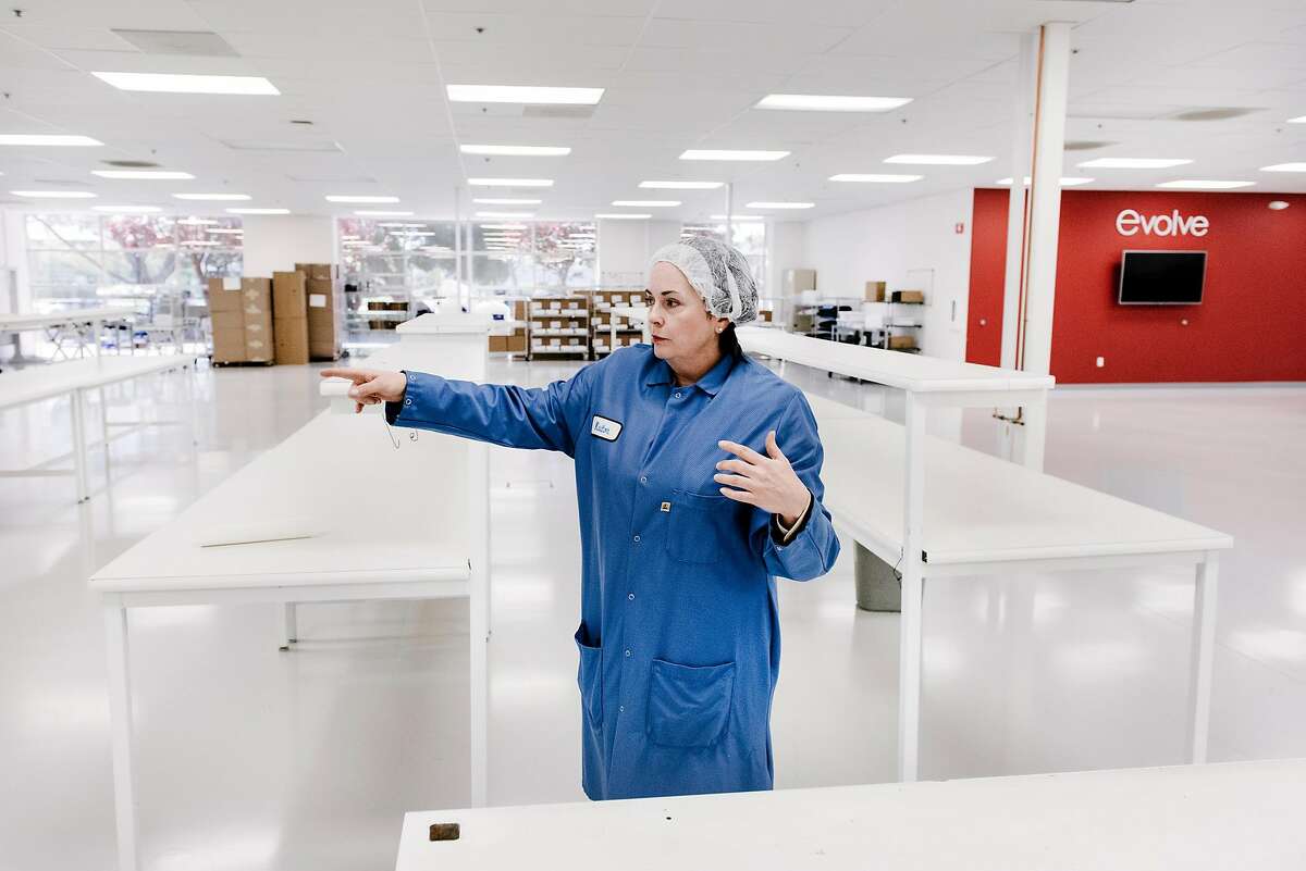 CEO Noreen King, points out features of an area where medical ventilators will be made at her company Evolve Manufacturing Technologies Inc. in Fremont, Calif, on Wednesday, April , 2020.