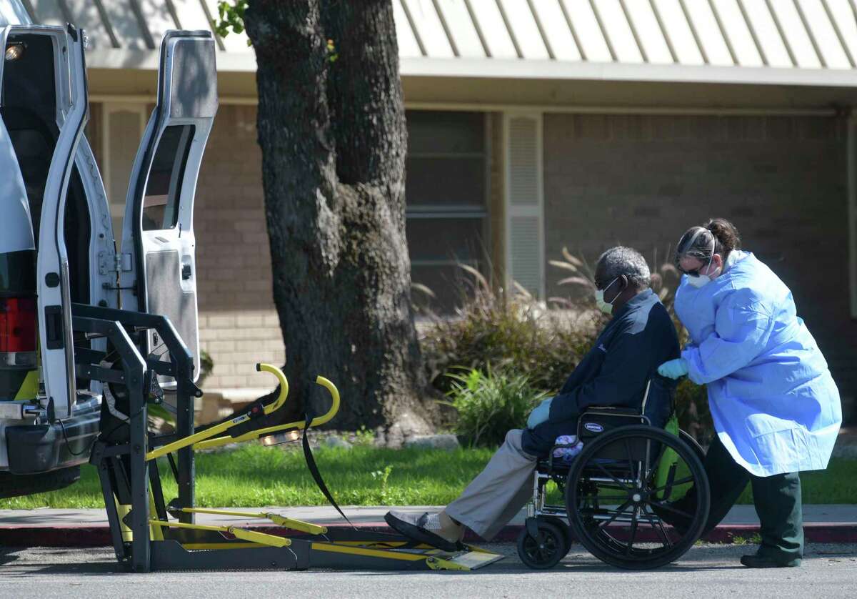 A resident is wheeled out of the Southeast Nursing and Rehabilitation Center, 4302 Southcross, on Wednesday, April 1, 2020. An outbreak is occurring at the facility, where six residents and six staff members have tested positive for the coronavirus. One person has died.