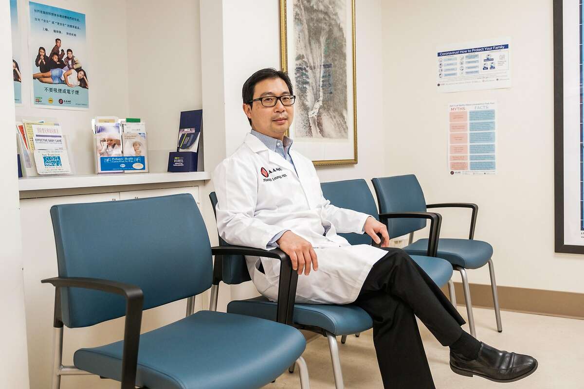 Dr. Man-Kit Leung, an ear, nose, and throat doctor poses for a photograph in the empty waiting room of his office in San Francisco, Calif. on Wednesday April 1, 2020.