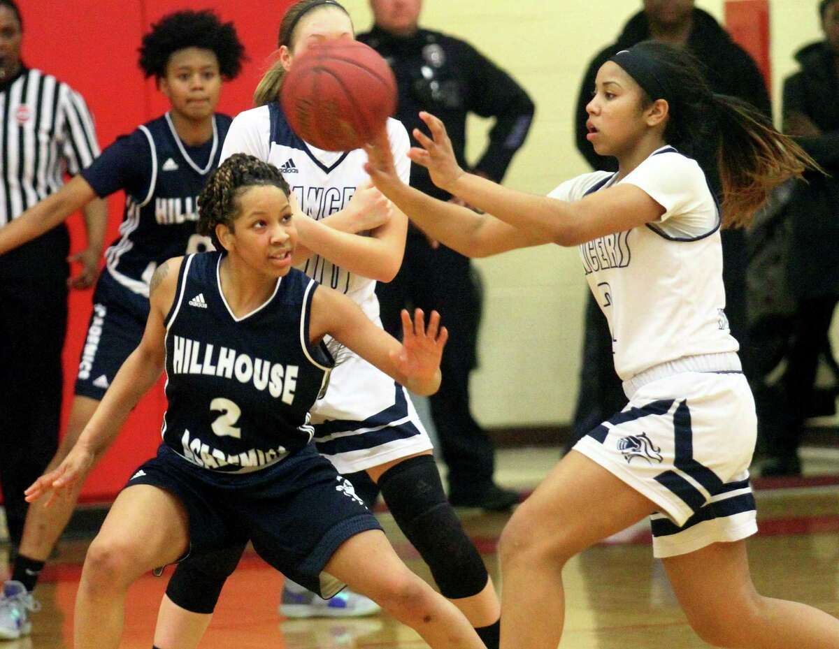 Notre Dame of Fairfield's Erin Harris (3) passes the ball as Hillhouse's Ciara Little (2) defends during CIAC Class L girls basketball tournament action in Monroe, Conn., on Friday Mar. 8, 2019.