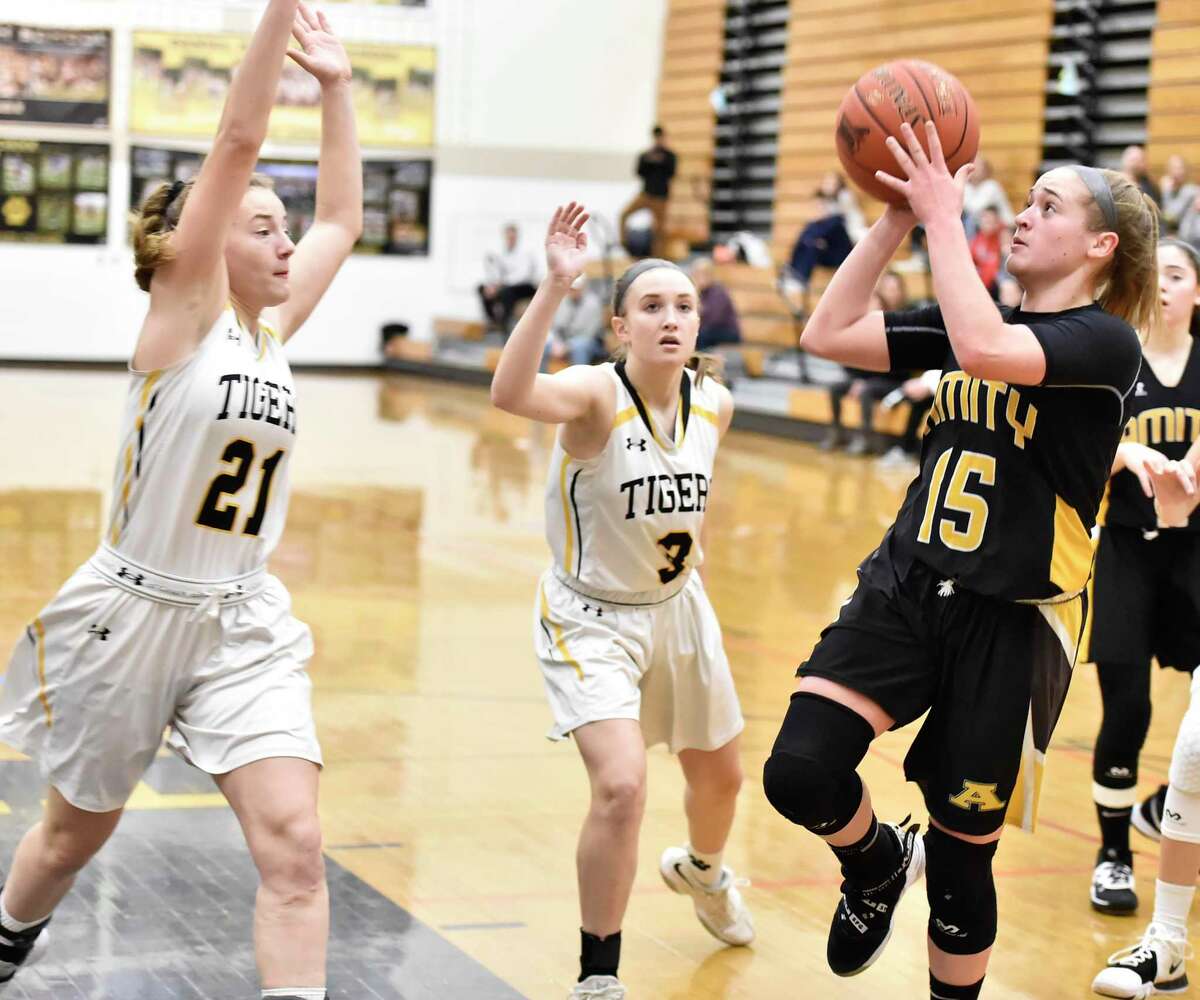 Madison, Connecticut -Wednesday, January 10, 2020: Jillian Martin of Amity H.S. drives to the basket against Daniel Hand H.S. during the first quarter of girls basketball Friday evening at Daniel Hand H.S.