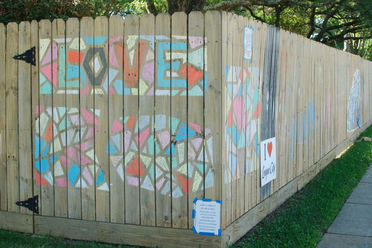 League City residents create fence graffiti art to pass the time during the mandatory stay at home order to prevent the spread of COVID-19.