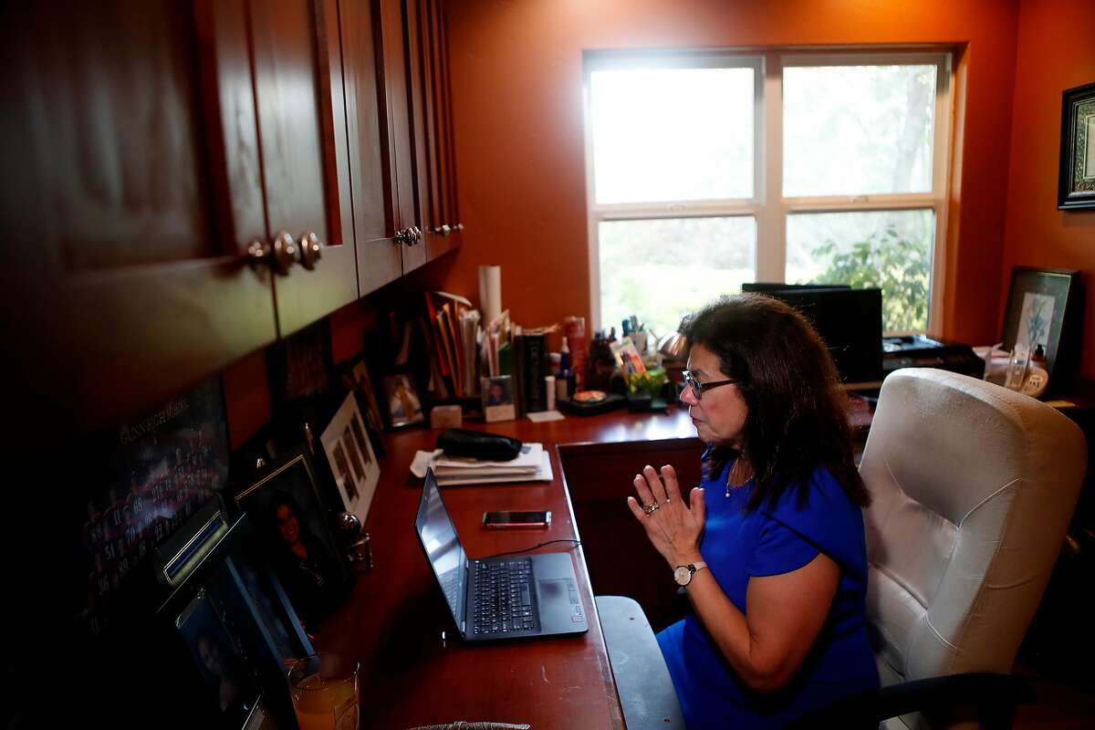 Stanford scientist Yvonne Maldonado is photographed during a phone conference call at her home office on Stanford campus, in California on March 27, 2020. Maldonado is one of the 10 scientists who is working on the coronavirus.