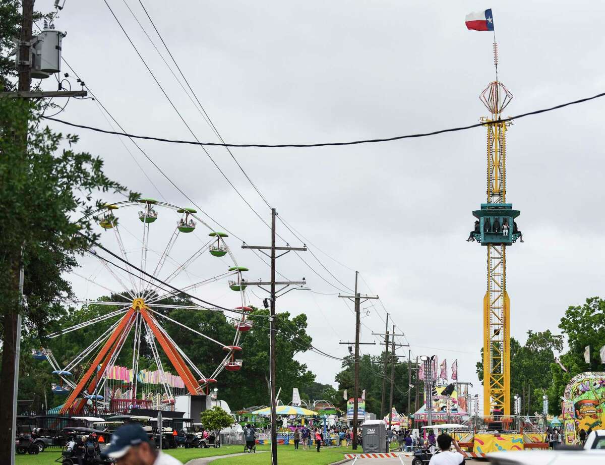 People enjoy one of the amusement rides at Port Neches RiverFest Wednesday afternoon. Photo taken on Wednesday, 05/01/19. Ryan Welch/The Enterprise