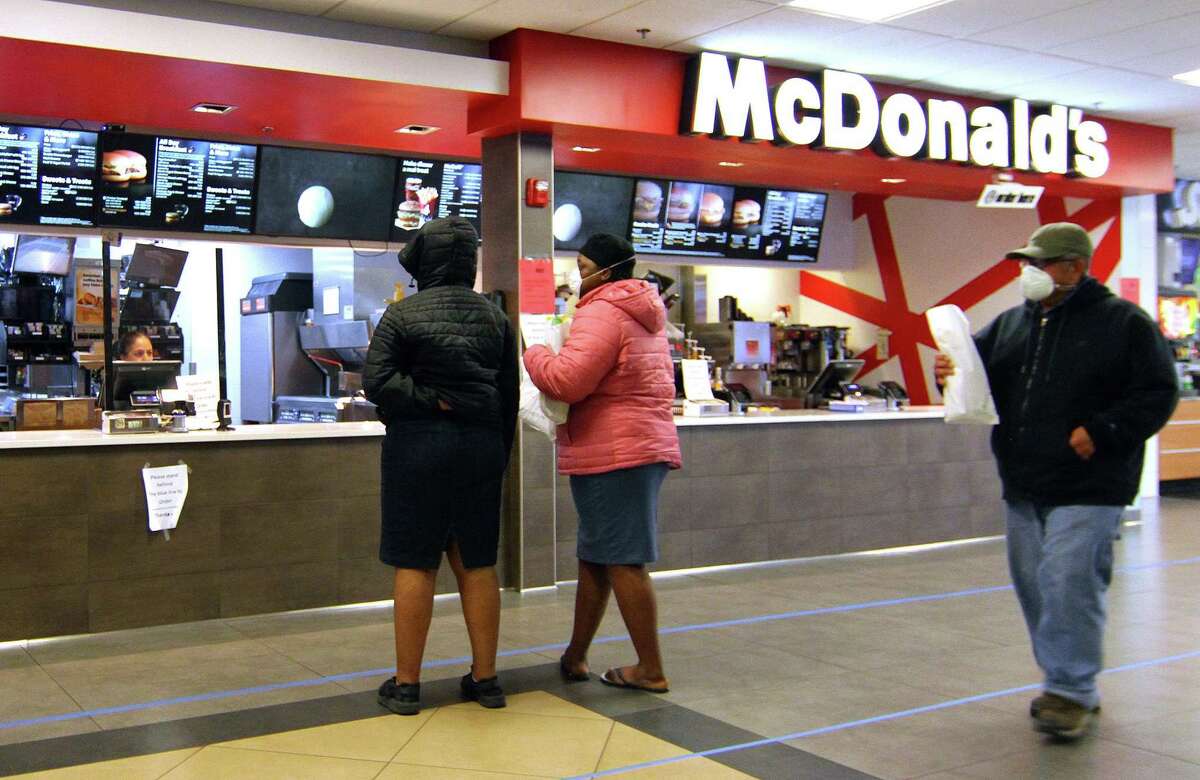 Customers wait for food at McDonald's at the 1-95 northbound rest plaza in Milford, Conn., on Thursday Mar. 2, 2020.