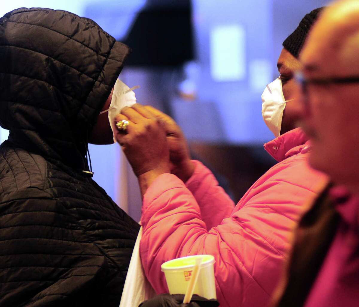 Customers wait for food at McDonald's at the 1-95 northbound rest plaza in Milford, Conn., on Thursday Mar. 2, 2020.