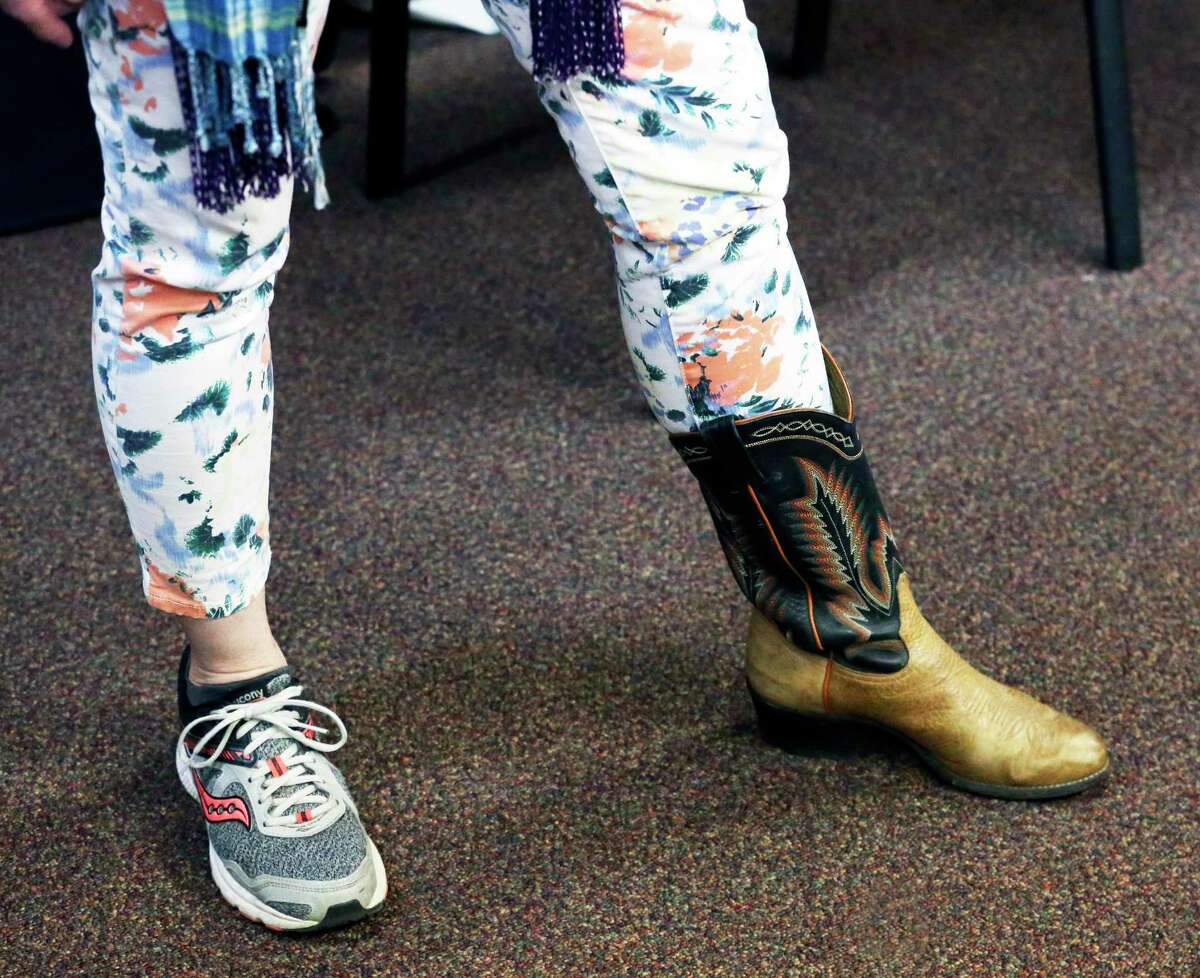 Alpha Home staff member Melissa Dobbertin wears mismatching foot apparel at the nonprofit’s recent Spirit Day. Like many substance abuse treatment programs in Bexar County, staff and clients have had to adjust to a “new normal” because of the coronavirus.
