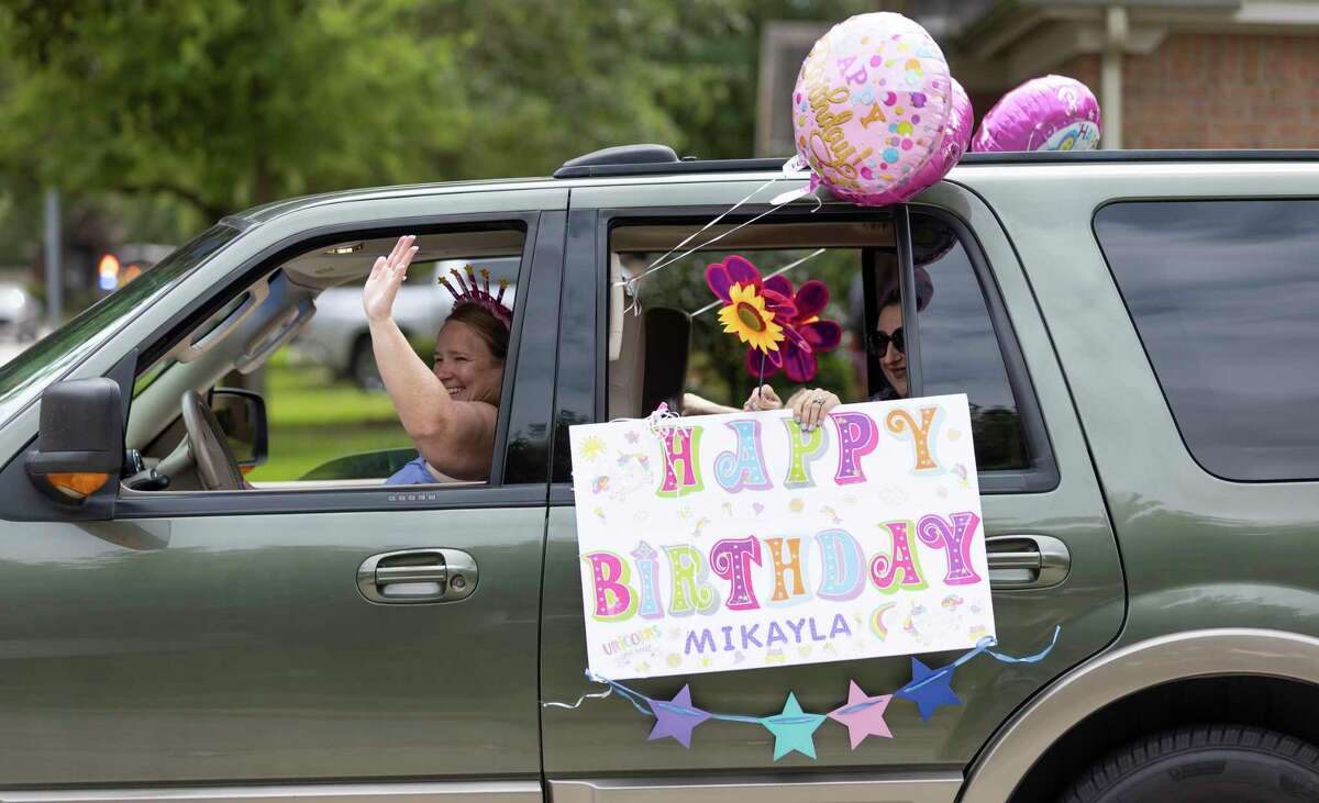 Residents of Eagle Springs participated in a drive-by celebratory birthday parade for Mikayla Bullock in Atascocita, Thursday, April 2, 2020.