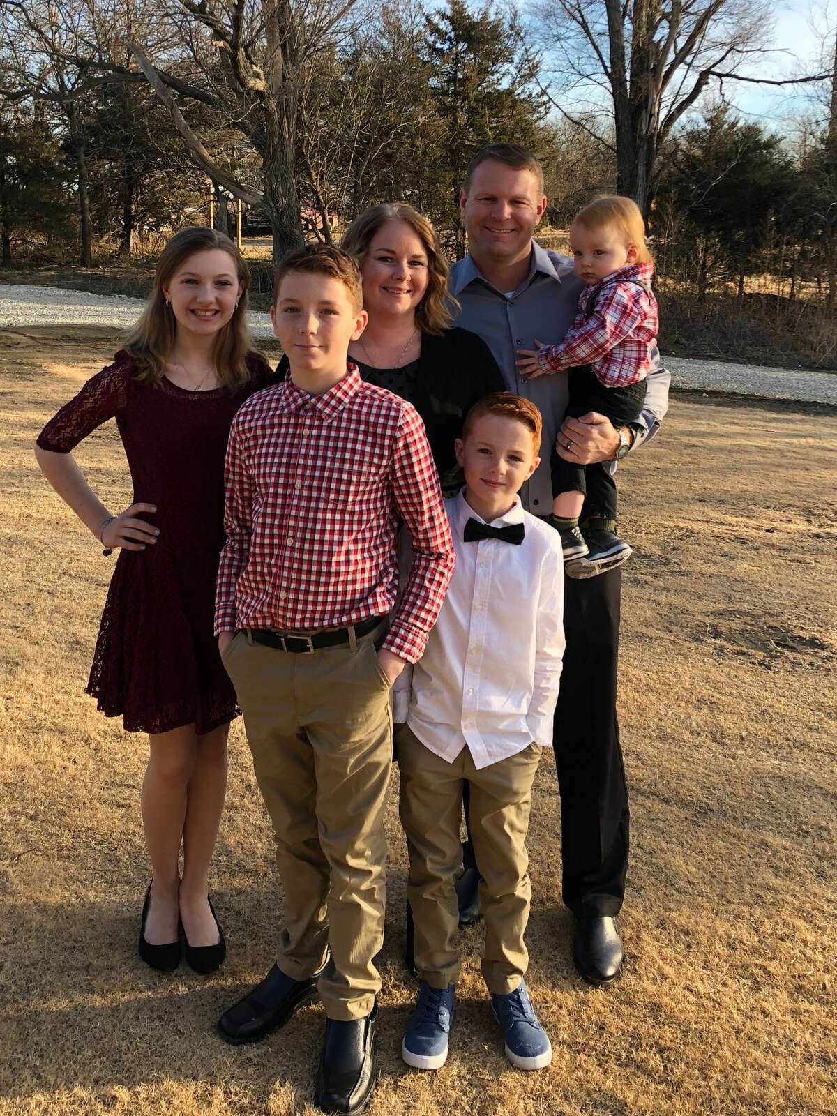 Mike Steele poses with his family (from left) daughter Margaret Grace, son Caleb, wife Lydia, son Merritt, and son Cullen.