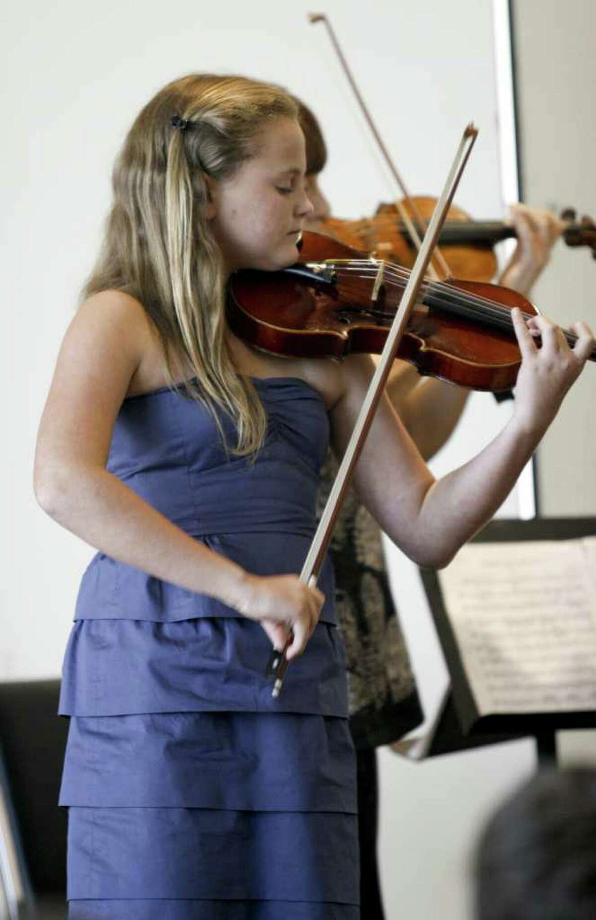 Anna Leunis of Darien, age 14, performs a duet with Asya Meshberg, Artistic Director of the Chamber Music Institute for Young Musicians, after receiving an award and scholarship from the Stamford Center for the Arts on Sunday, August 8, 2010.