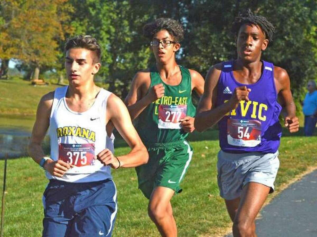 In this file photo, Metro-East Lutheran freshman Elijah Schlessinger, middle, runs on Oct. 8 in the small-school boys race in the Madison County Meet at Belk Park in Wood River.