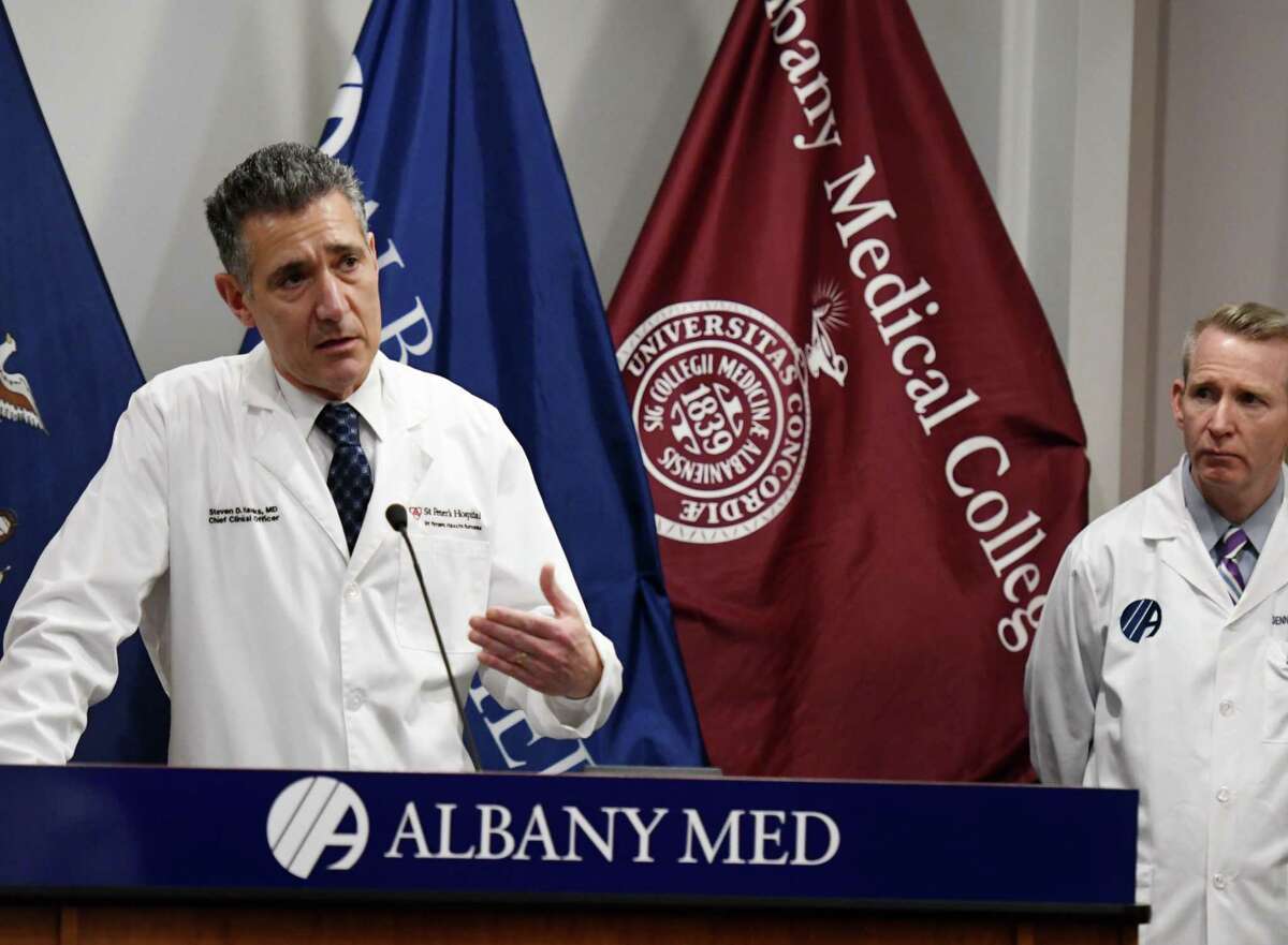 Dr. Steven D. Hanks, chief clinical officer for St. Peter's Health Partners, left, and Dr. Dennis P. McKenna, president and CEO of Albany Medical Center, right, speak to reporters during a joint press conference where leaders from Capital Region hospitals gave updates on their ongoing coronavirus preparations on Friday, April 3, 2020, at Albany Med in Albany, N.Y. (Will Waldron/Times Union)