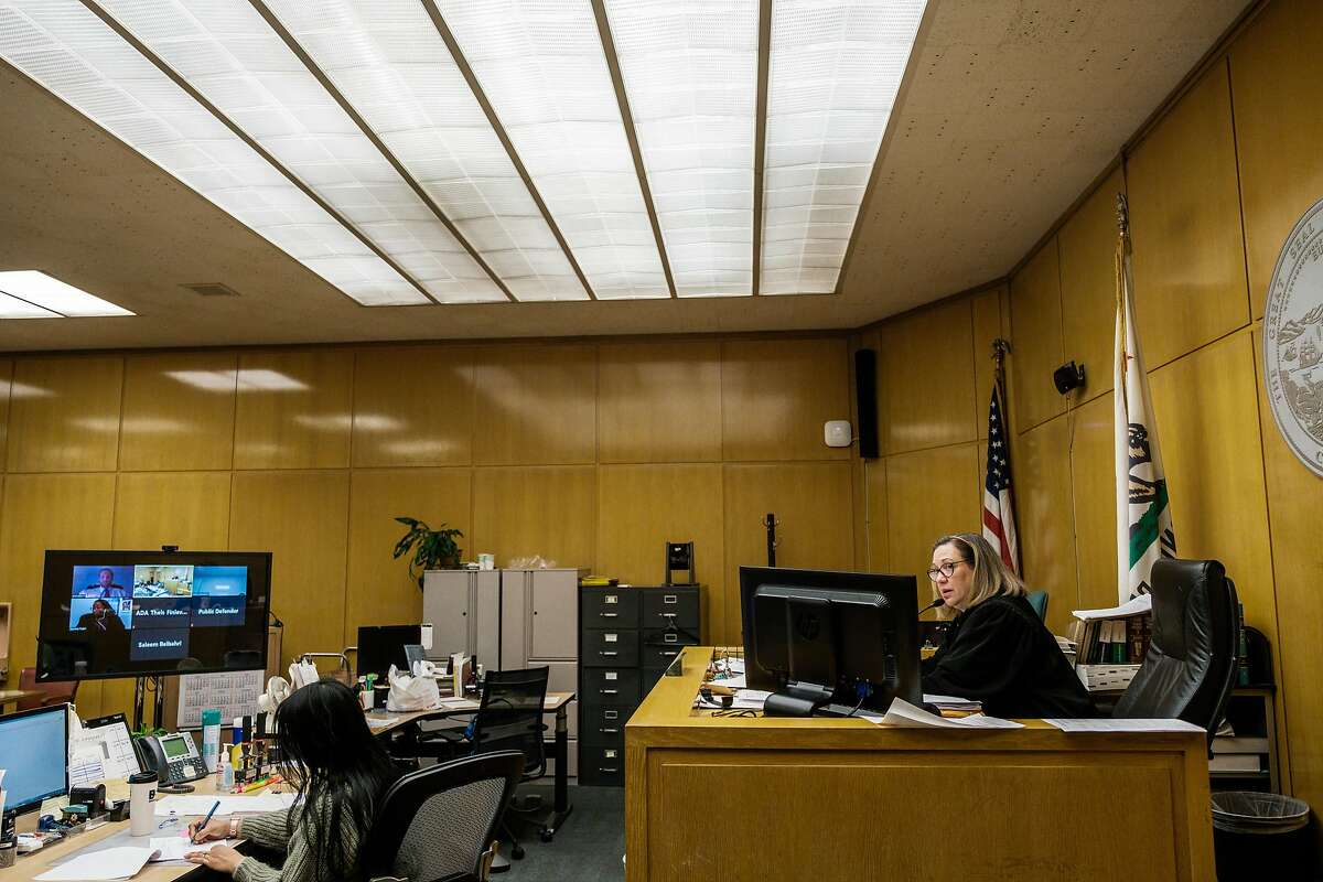 Judge Loretta Giorgi presides over court cases while other officers of the court contribute remotely in San Francisco, Calif. on Friday April 3, 2020.