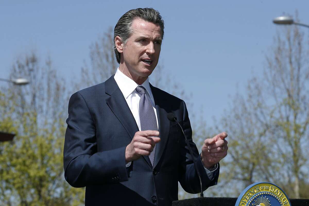Gov. Gavin Newsom discuses California's efforts to convert hotels and motels into isolation housing for the homeless threatened by the coronavirus during a news conference near Sacramento, Calif. April 3, 2020. Newsom spoke about the partnership with the Federal Emergency Management Agency to cover some costs outside a recently converted motel.(AP Photo/Rich Pedroncelli, Pool)