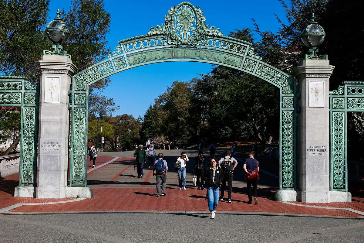 People walk through the UC Berkeley campus a day after Berkeley suspended in-person classes through the end of Spring break due to the coronavirus on Tuesday, March 10, 2020 in Berkeley, California.