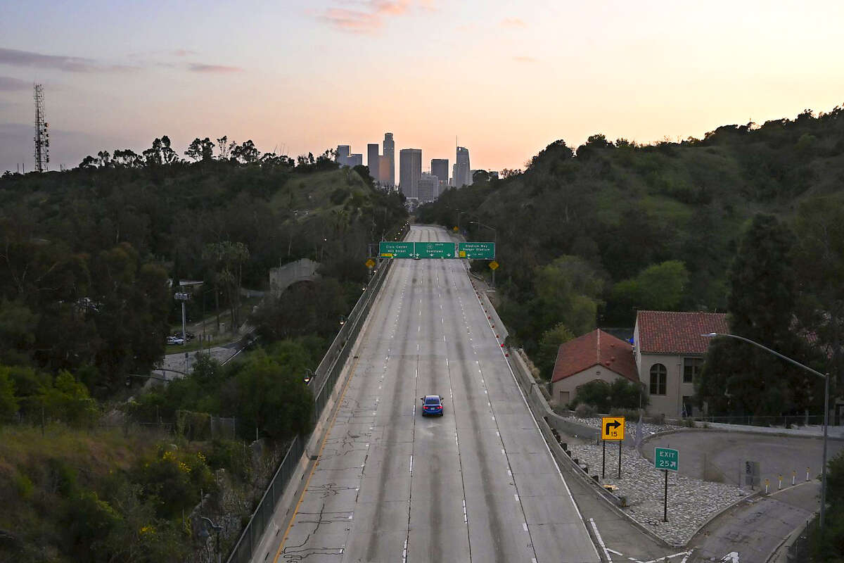 Few cars occupy the Arroyo Seco Parkway toward downtown Los Angeles during rush hour, Thursday, April 2, 2020, in Los Angeles, during the coronavirus pandemic. (AP Photo/Mark J. Terrill)