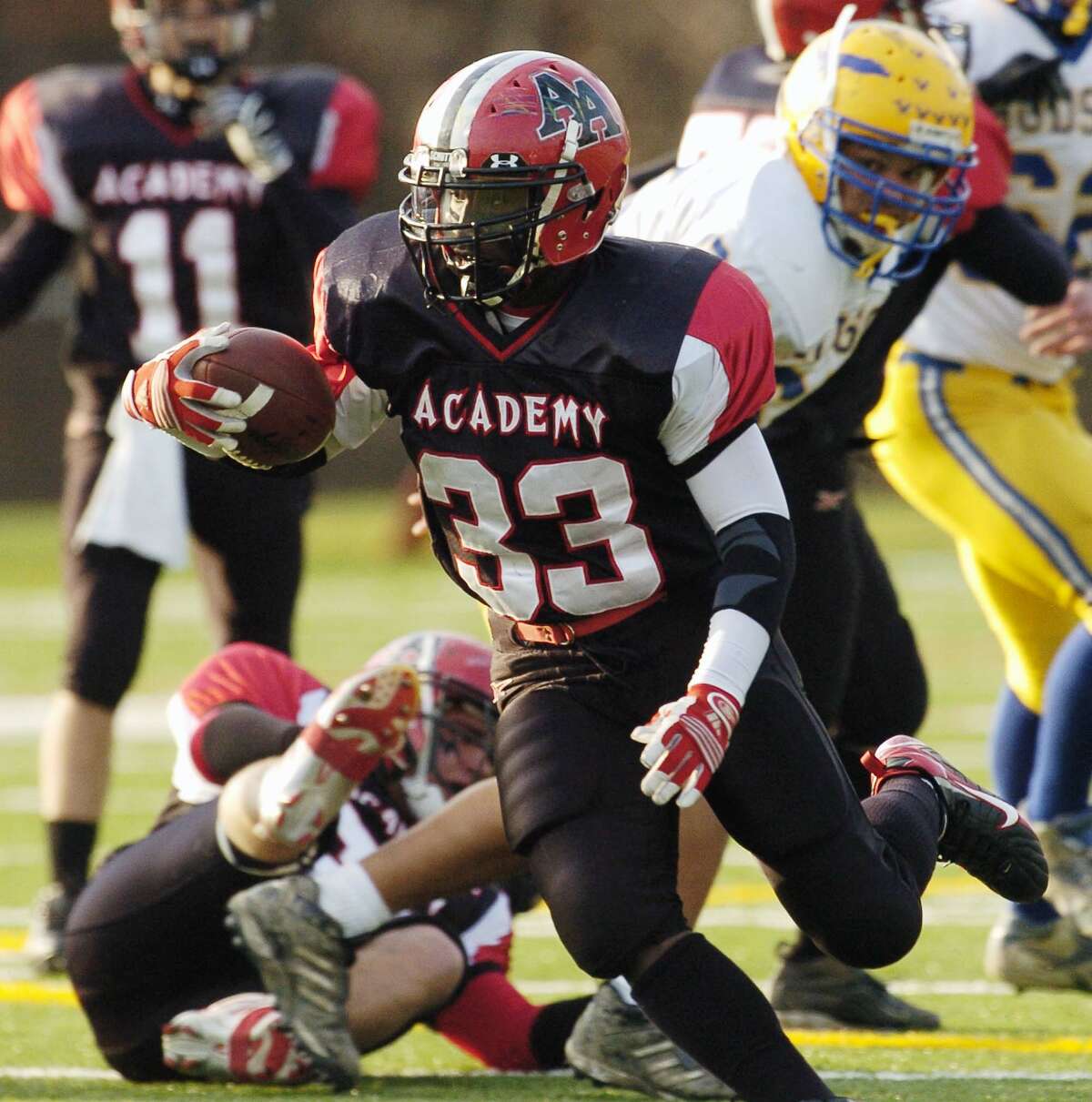 Times Union Photo by James Goolsby-Nov.4, 2006-Albany Academy #33-RB-Dion Lewis runs through a big hole in the Hudson defense. In the first half of the Class C Superbowl in Amsterdam N.Y.