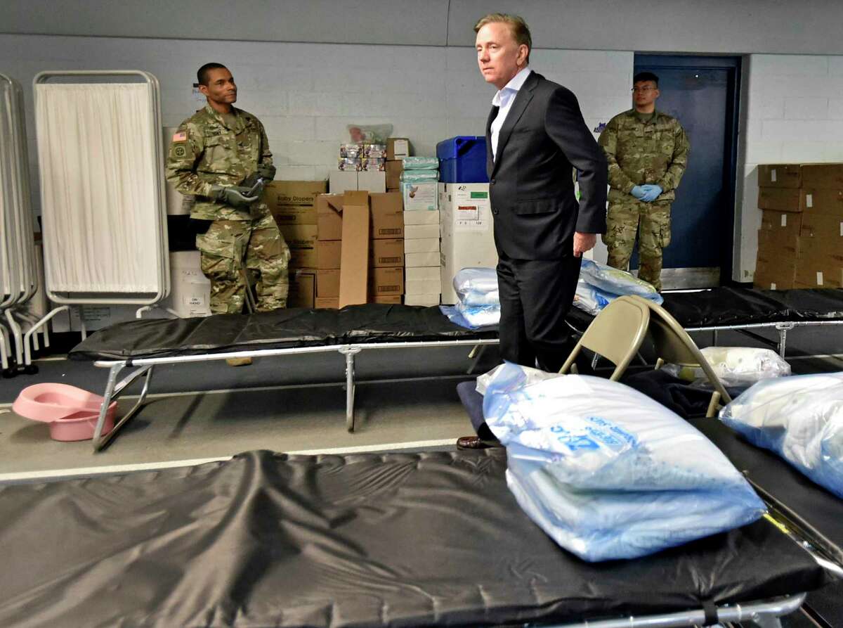 Gov. Ned Lamont tours a Federal Emergency Management Agency 250-bed medical field hospital Wednesday for non-coronavirus patients in the Southern Connecticut State University Moore Field House in New Haven staged by members of the Connecticut National Guard's 1-102nd Infantry. The site is intended to treat non-COVID-19 patients so there will be more hospital beds people who are impacted by COVID-19.