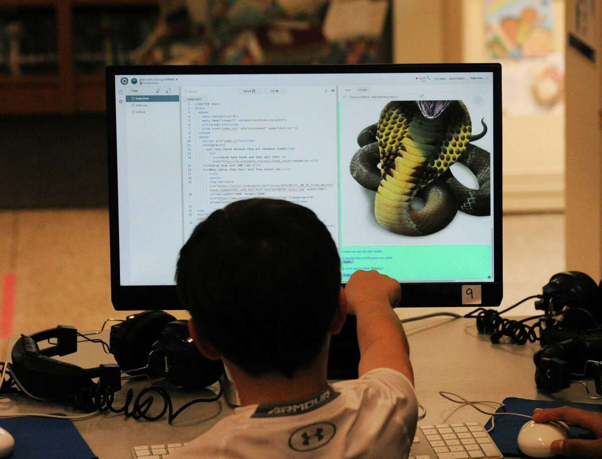 A second-grader at the Riverside School, works on the computer code for his website about snakes at the Riverside School in Greenwich, Conn., Tuesday, June 12, 2018.