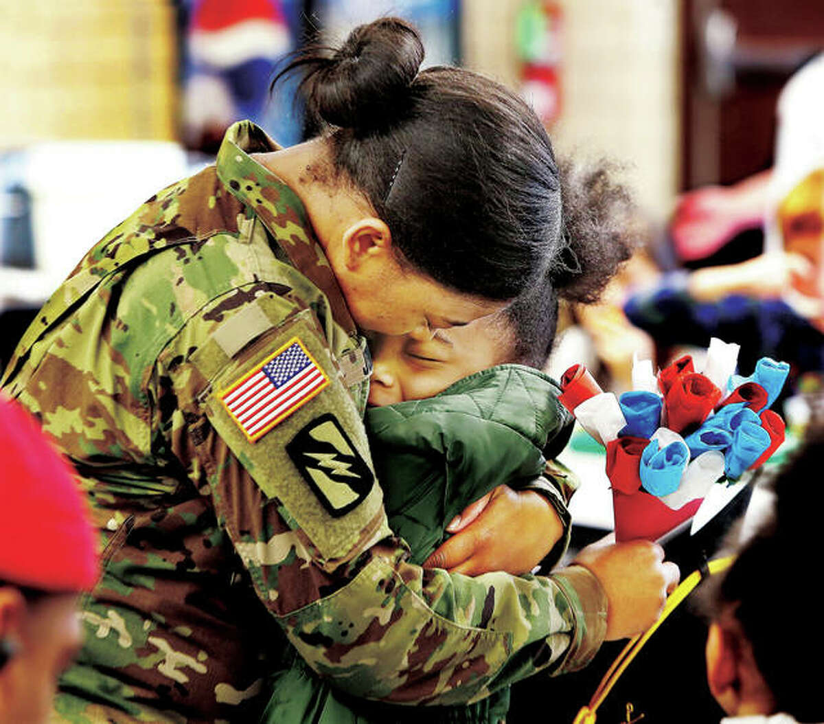 John Badman of The Telegraph won a first place award in the 2019 Illinois Press Association for this photo of Sgt. Kyra Jones, who just returned home from a year-long deployment to Kuwait, giving a hug to her daughter, Raquel, a second grade student at Alton’s West Elementary School. The newspaper won 18 awards in this year’s competition.