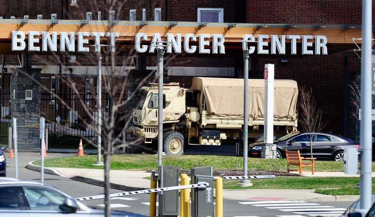 A National Guard truck is seen on the grounds of Stamford Hospital Saturday. Guard personnel were in Stamford to help prepare the Wheeler Building on the hospital campus for extra needs brought on by the coronavirus pandemic.