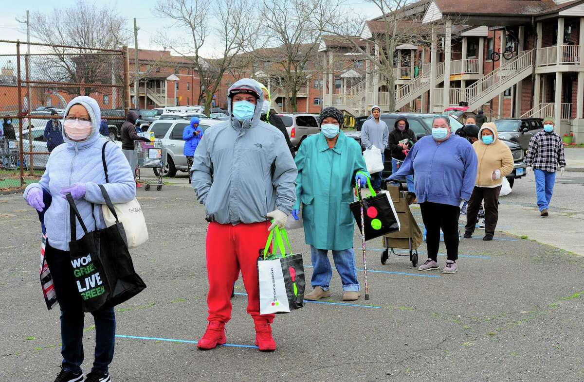 PT Partners hold its monthly PT Barnum food distribution event in Bridgeport, Conn., on Saturday Apr. 4, 2020. The coronavirus has increased demand for food and PT Partners say they are now running low on donations from various food banks they rely on.