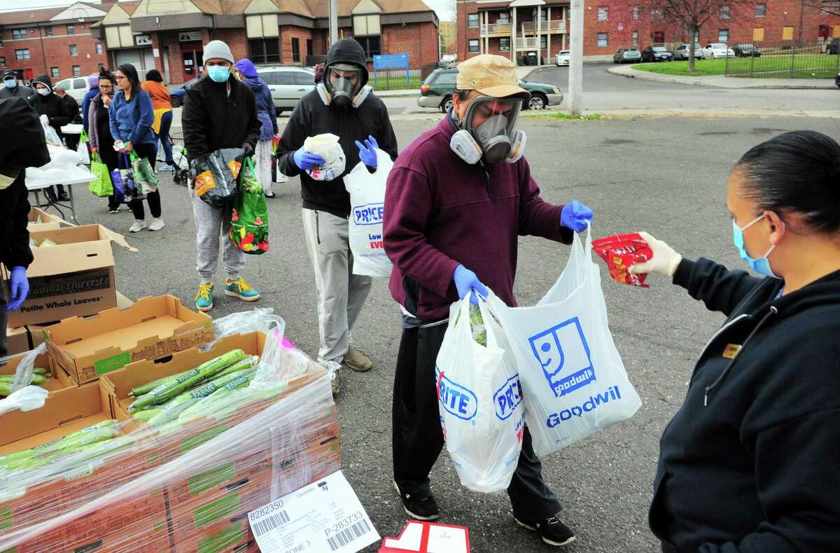 PT Partners hold its monthly PT Barnum food distribution event in Bridgeport, Conn., on Saturday Apr. 4, 2020. The coronavirus has increased demand for food and PT Partners say they are now running low on donations from various food banks they rely on.