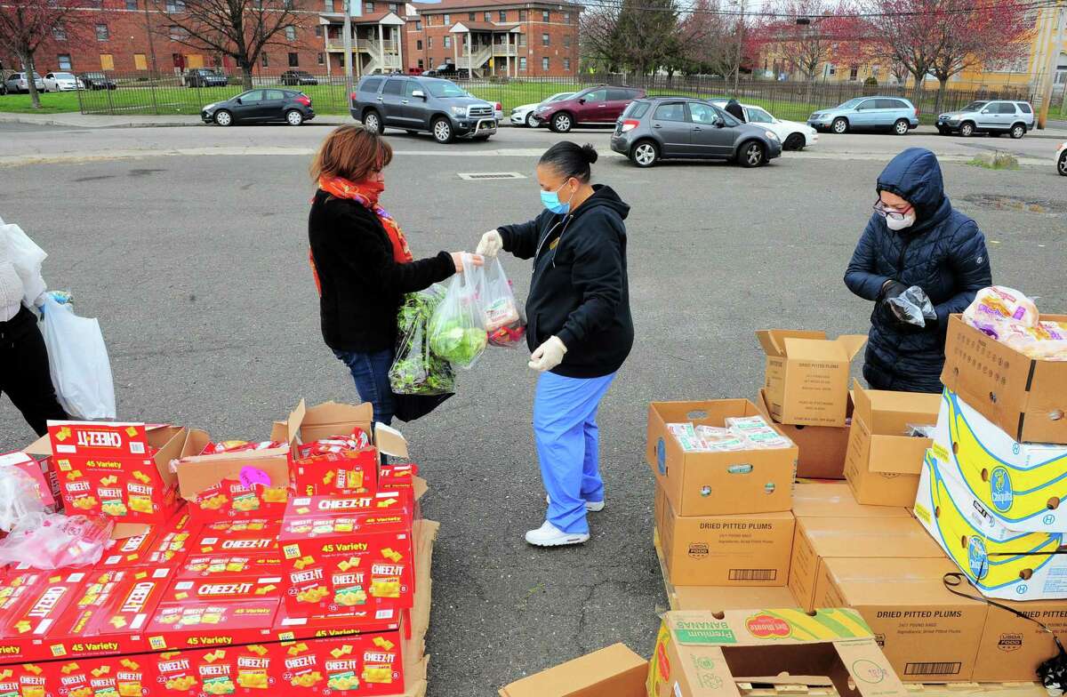 PT Partners hold its monthly PT Barnum food distribution event in Bridgeport, Conn., on Saturday Apr. 4, 2020. The coronavirus has increased demand for food and PT Partners say they are now running low on donations from various food banks they rely on.