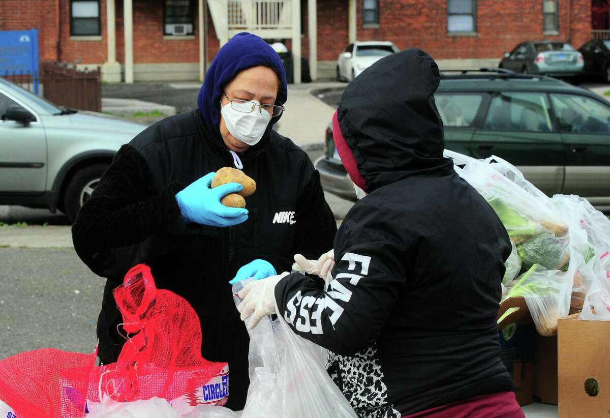 PT Partners hold its monthly PT Barnum food distribution event in Bridgeport, Conn., on Saturday Apr. 4, 2020. The coronavirus has increased demand for food and PT Partners say they are now running low on donations from various food banks they rely on.