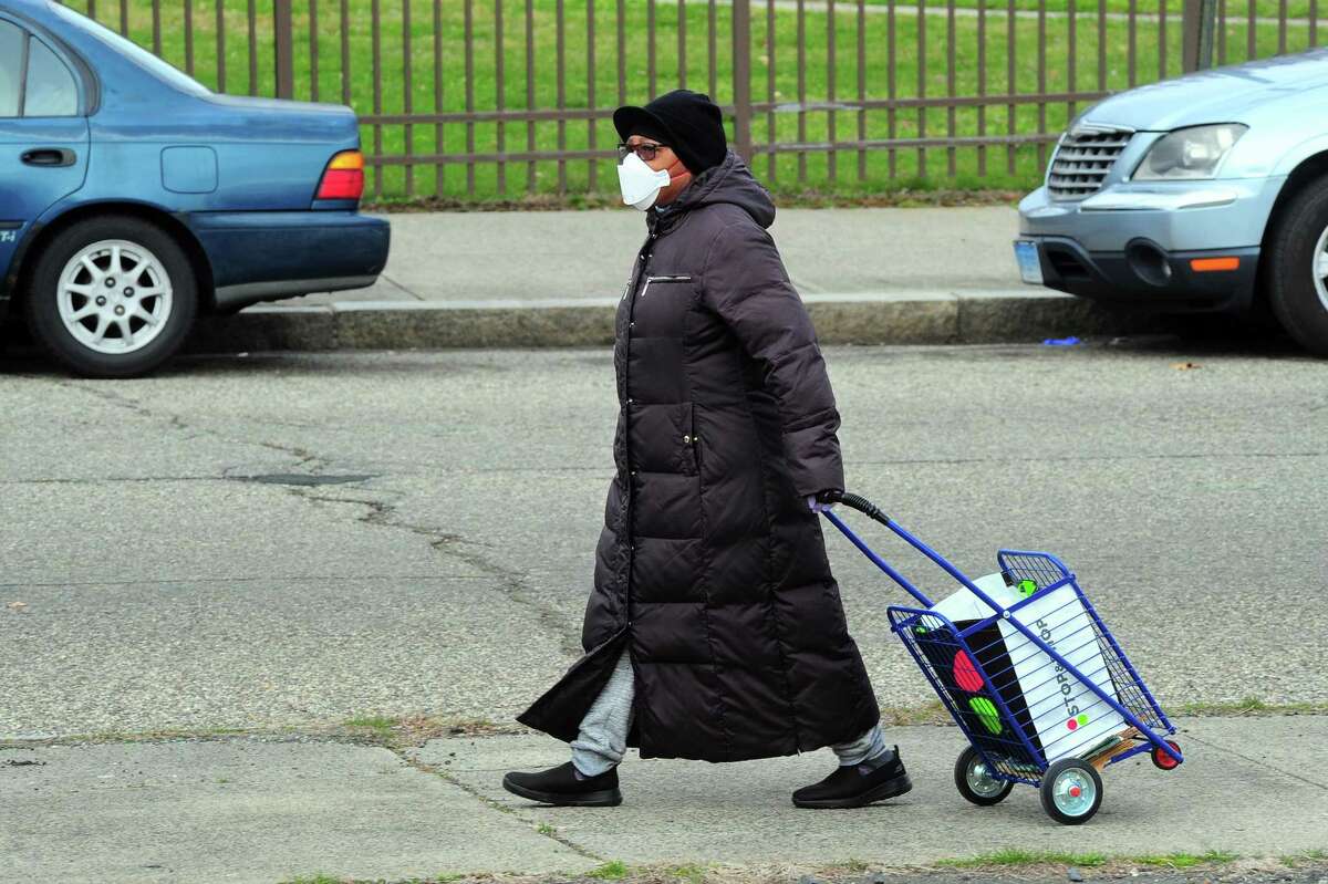 PT Partners hold its monthly PT Barnum food distribution event in Bridgeport, Conn., on Saturday Apr. 4, 2020. The coronavirus has increased demand for food and PT Partners say they are now running low on donations from various food banks they rely on.