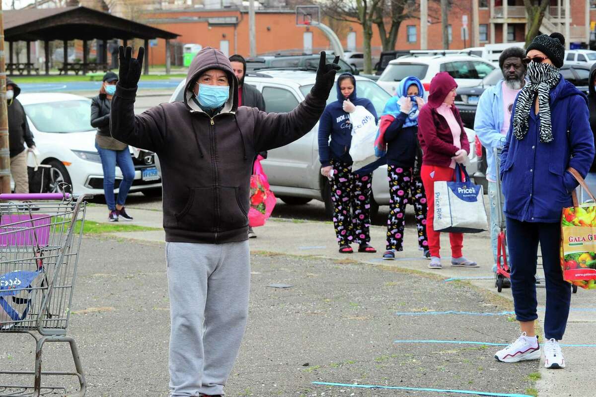 PT Partners hold its monthly PT Barnum food distribution event in Bridgeport, Conn., on Saturday Apr. 4, 2020. The coronavirus has increased demand for food and PT Partners say they are now running low on donations from various food banks they rely on.