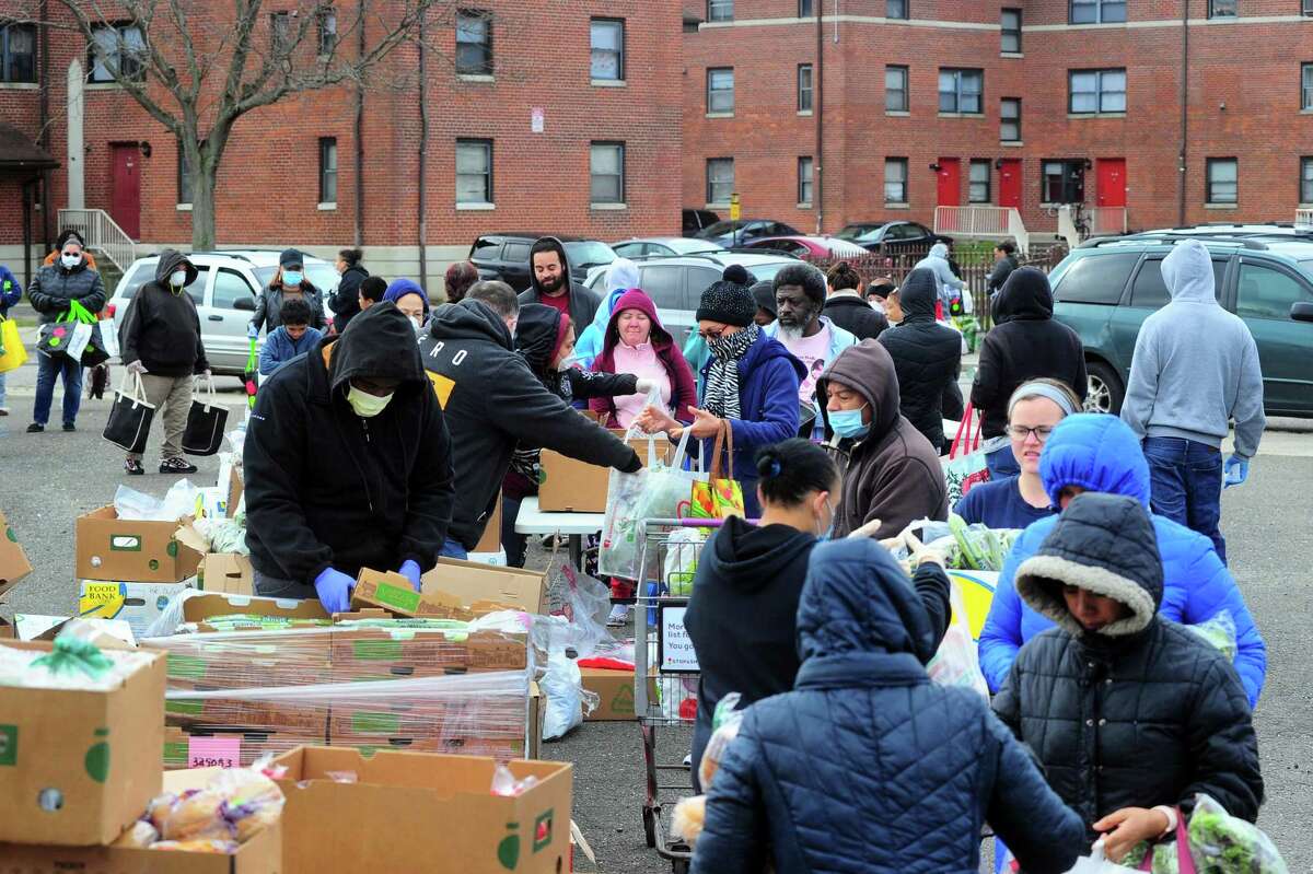 PT Partners hold its monthly PT Barnum food distribution event in Bridgeport, Conn., on Saturday Apr. 4, 2020. The coronavirus has increased demand for food and PT Partners say they are now running low on donations from various food banks they rely on.