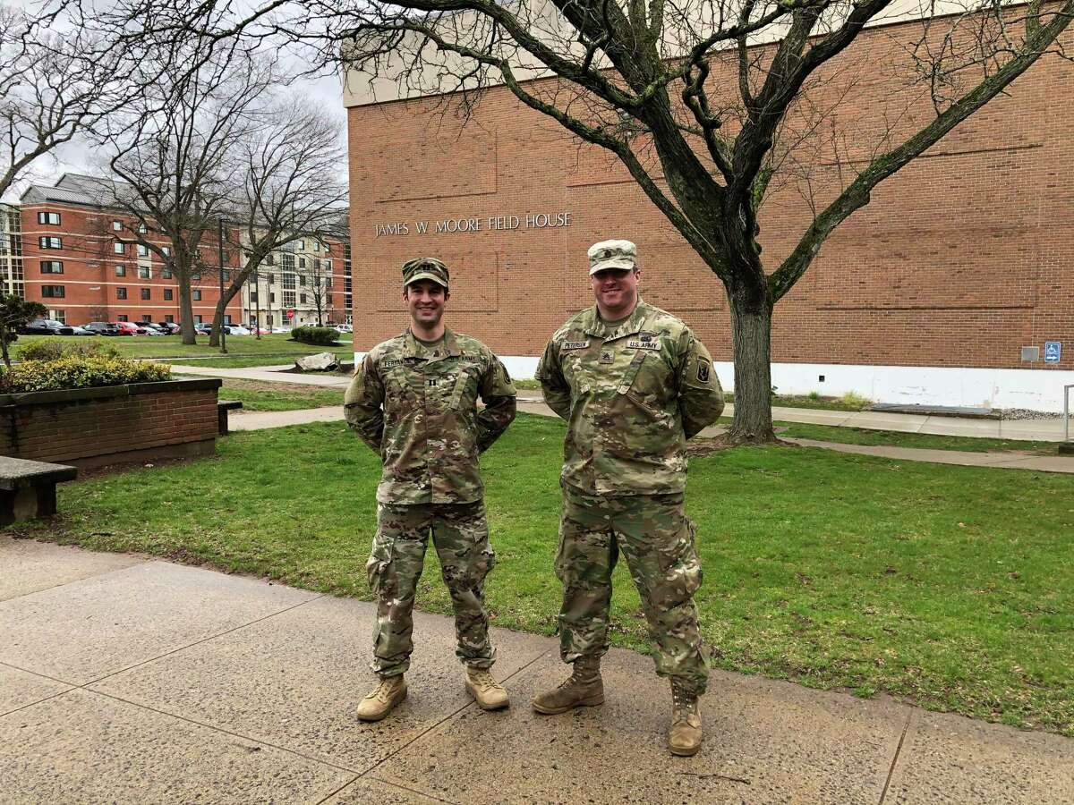 Capt. Nathan Ferrance and Staff Sgt. Timothy Peterson are two leaders of the Connecticut Army National Guard 102nd Infantry Regiment’s Bravo Company, which is working to prepare the Moore Field House at Southern Connecticut State University as a temporary hospital for COVID-19 patients. The site will be staffed by Yale New Haven Health professionals, and will be used for patients who do not need intensive care, as hospitalizations continue to surge.